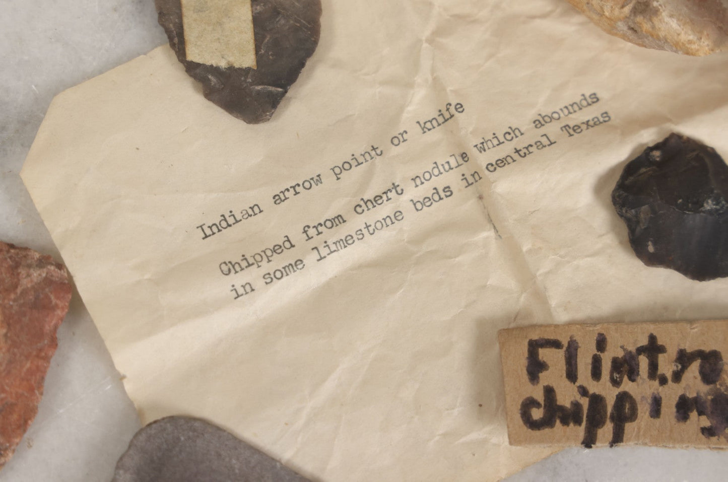 Lot 054 - Five Piece Grouping Of Indigenous Native American Indian Arrowheads And Tools With Handwritten And Typewritten Notations