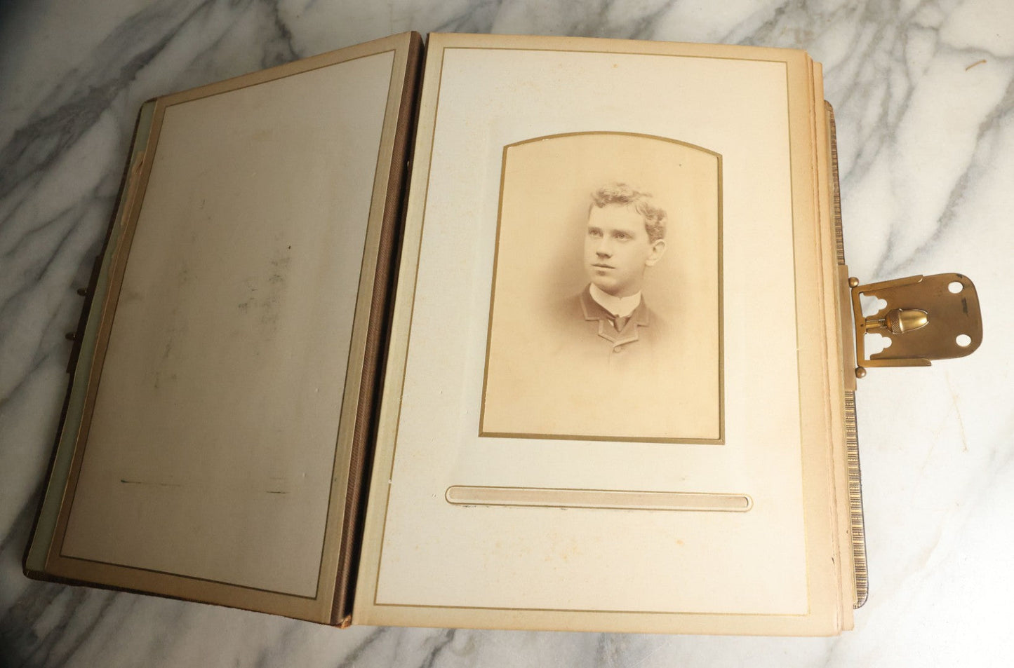 Lot 059 - Antique Photo And Keepsake Album With Cabinet Card, Tintype, And C.D.V. Photos, Remembrance Card & Hair From Mrs. Laura E. Little, Hidden Mother Tintype With Scratched Out Face, Photo Of Back Of Woman's Hair, Textile Keepsakes, Pressed Foliage