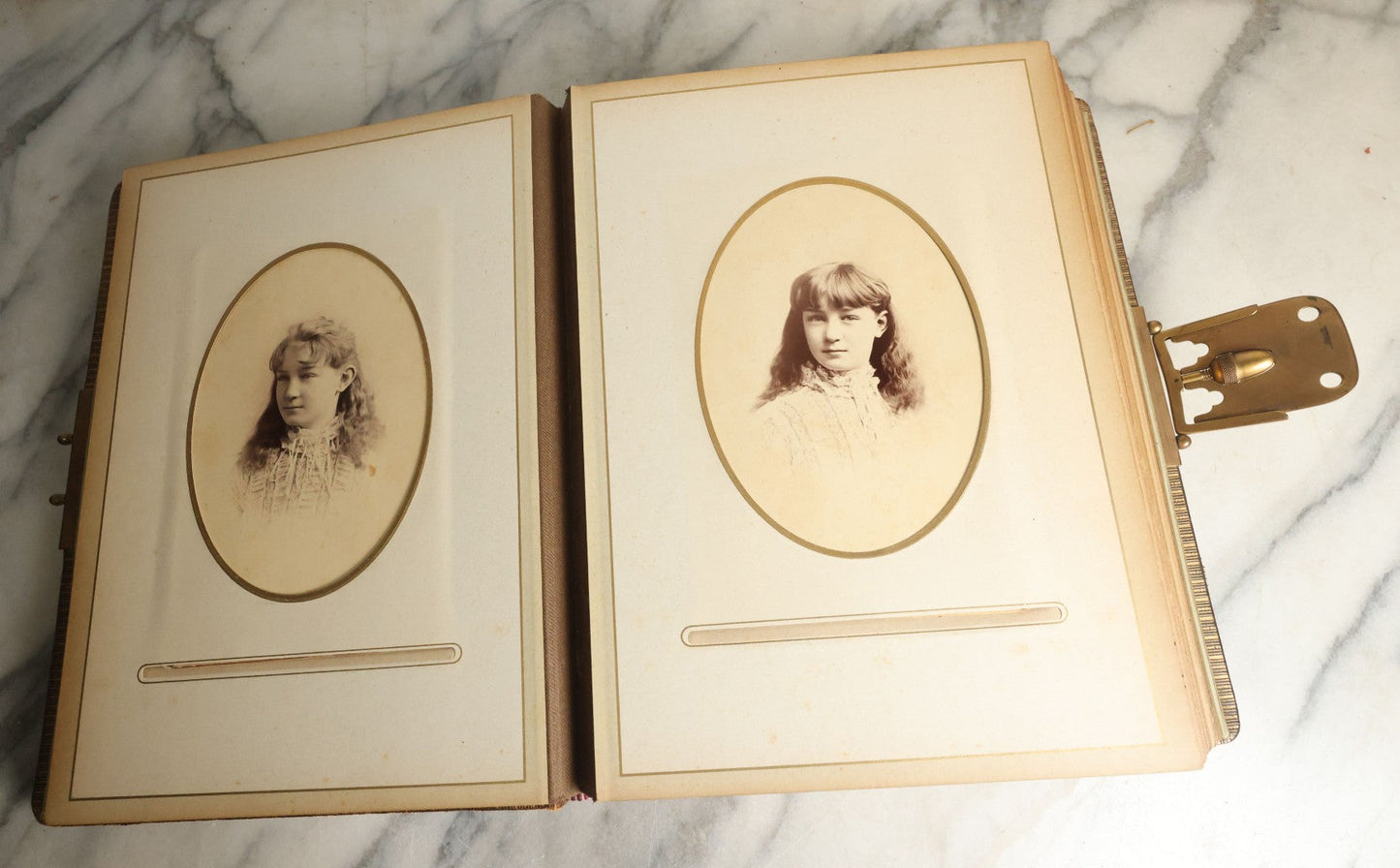 Lot 059 - Antique Photo And Keepsake Album With Cabinet Card, Tintype, And C.D.V. Photos, Remembrance Card & Hair From Mrs. Laura E. Little, Hidden Mother Tintype With Scratched Out Face, Photo Of Back Of Woman's Hair, Textile Keepsakes, Pressed Foliage