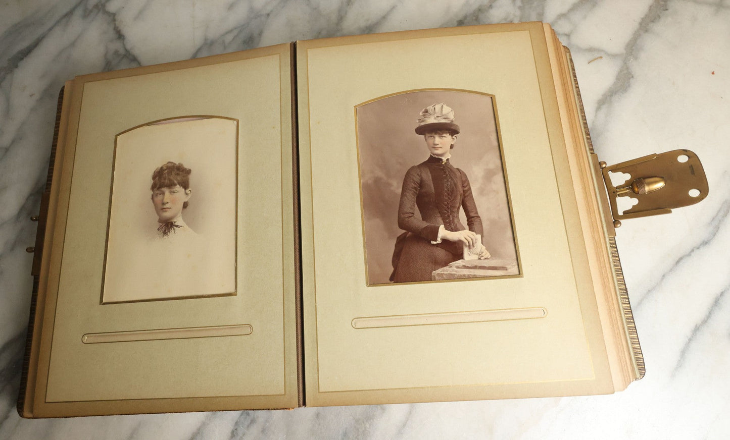 Lot 059 - Antique Photo And Keepsake Album With Cabinet Card, Tintype, And C.D.V. Photos, Remembrance Card & Hair From Mrs. Laura E. Little, Hidden Mother Tintype With Scratched Out Face, Photo Of Back Of Woman's Hair, Textile Keepsakes, Pressed Foliage