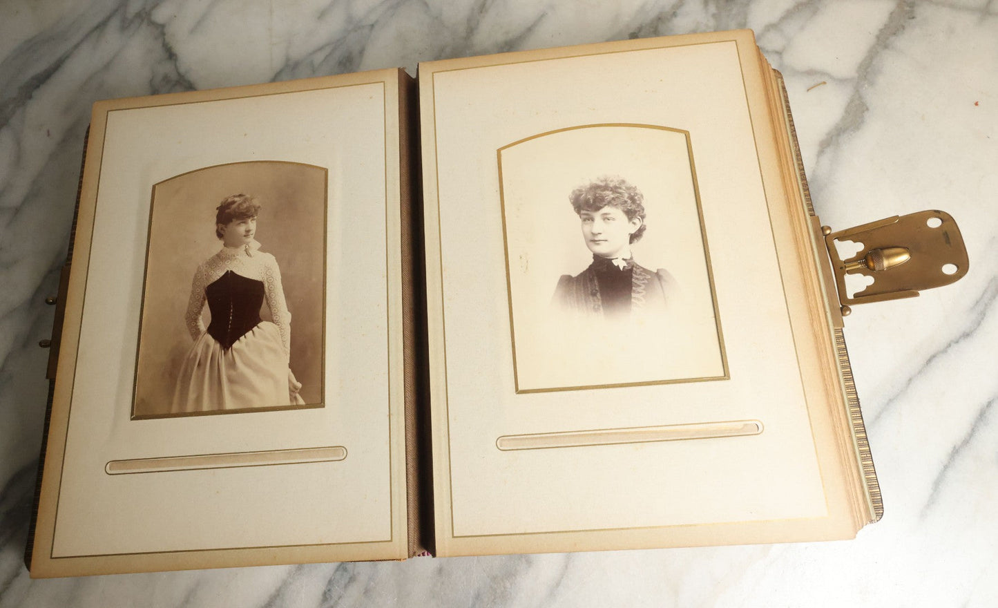 Lot 059 - Antique Photo And Keepsake Album With Cabinet Card, Tintype, And C.D.V. Photos, Remembrance Card & Hair From Mrs. Laura E. Little, Hidden Mother Tintype With Scratched Out Face, Photo Of Back Of Woman's Hair, Textile Keepsakes, Pressed Foliage