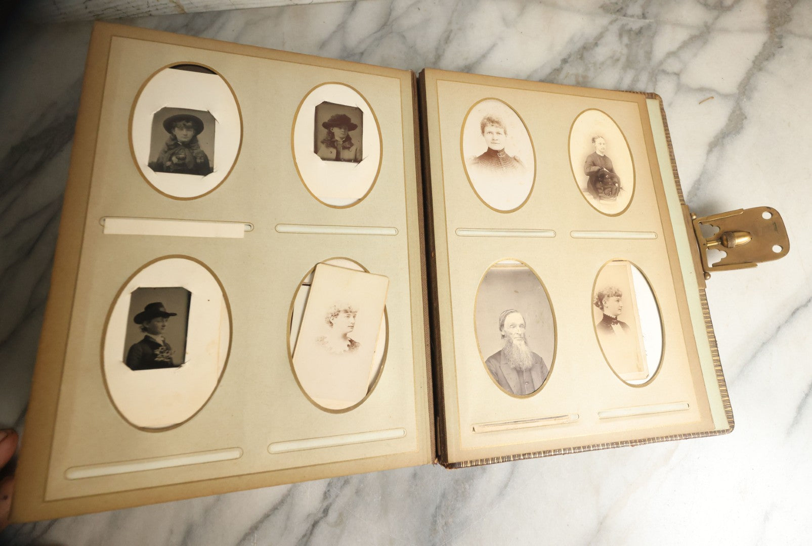 Lot 059 - Antique Photo And Keepsake Album With Cabinet Card, Tintype, And C.D.V. Photos, Remembrance Card & Hair From Mrs. Laura E. Little, Hidden Mother Tintype With Scratched Out Face, Photo Of Back Of Woman's Hair, Textile Keepsakes, Pressed Foliage