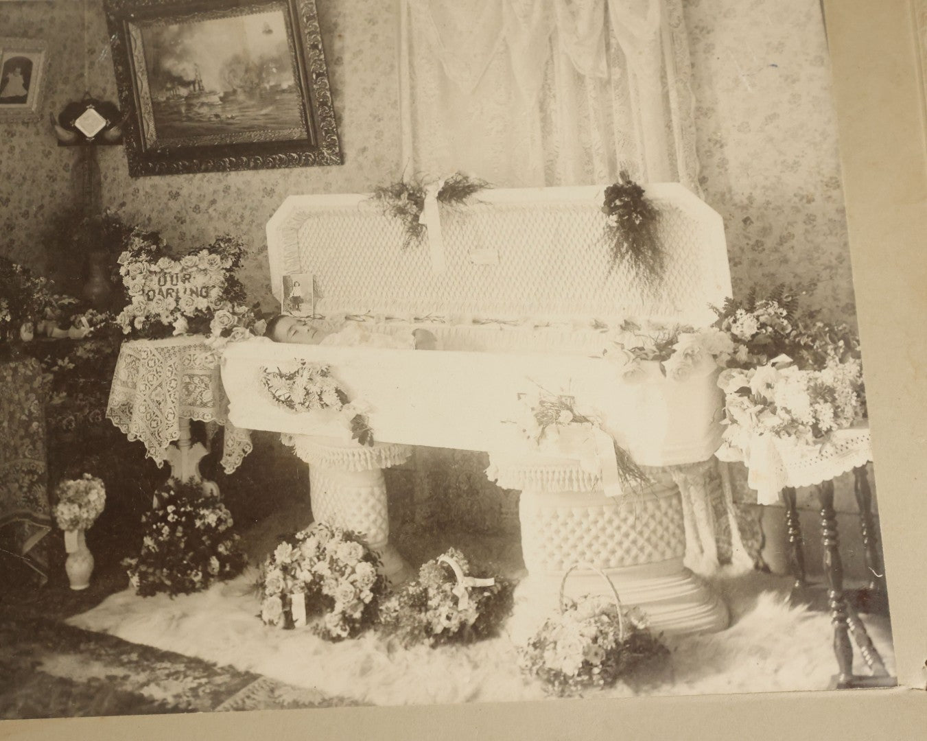 Lot 060 - Antique Boarded Post Mortem Funeral Photograph Of Young Boy In His Casket, With Various Flower Arrangements Including "Our Darling," Paige & Barker, Photographers, Concord, New Hampshire