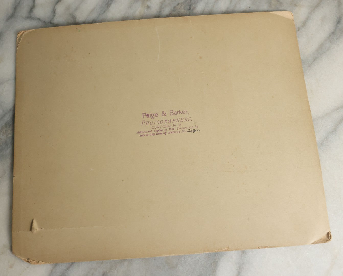 Lot 060 - Antique Boarded Post Mortem Funeral Photograph Of Young Boy In His Casket, With Various Flower Arrangements Including "Our Darling," Paige & Barker, Photographers, Concord, New Hampshire
