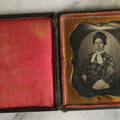 Lot 062 - Antique 1/6th Plate Daguerreotype Photograph Of Woman In Plaid Dress With White Scarf In Intact Leatherette Union Case, Note Dents And Wear To Photo