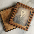 Lot 063 - Antique 1/6th Plate Daguerreotype Photograph With Middle Age Woman With White Hair Wearing White Bonnet And Scarf, In Split Leatherette Union Case With Bird Design