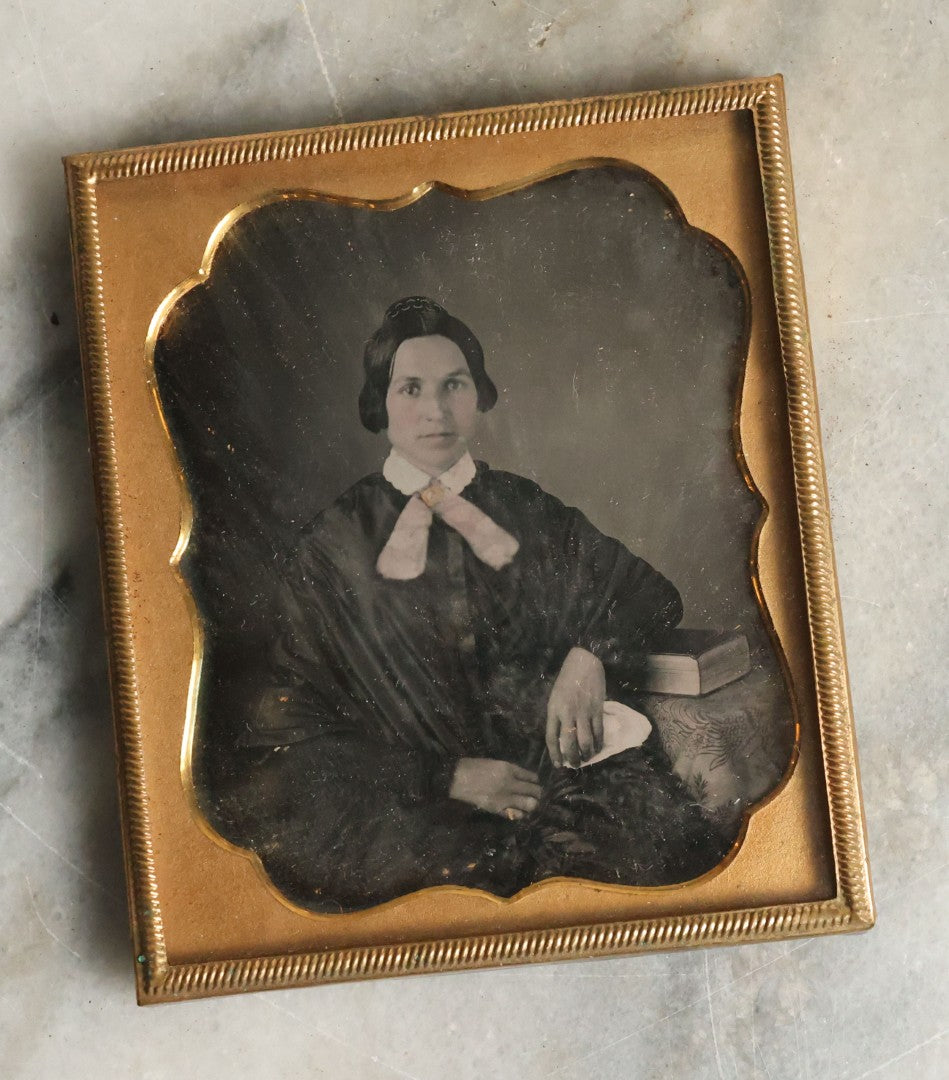 Lot 065 - Antique 1/6th Plate Daguerreotype Photograph Of Woman Wearing Gold Tinted Jewelry Sitting Beside Table With Book, No Case.