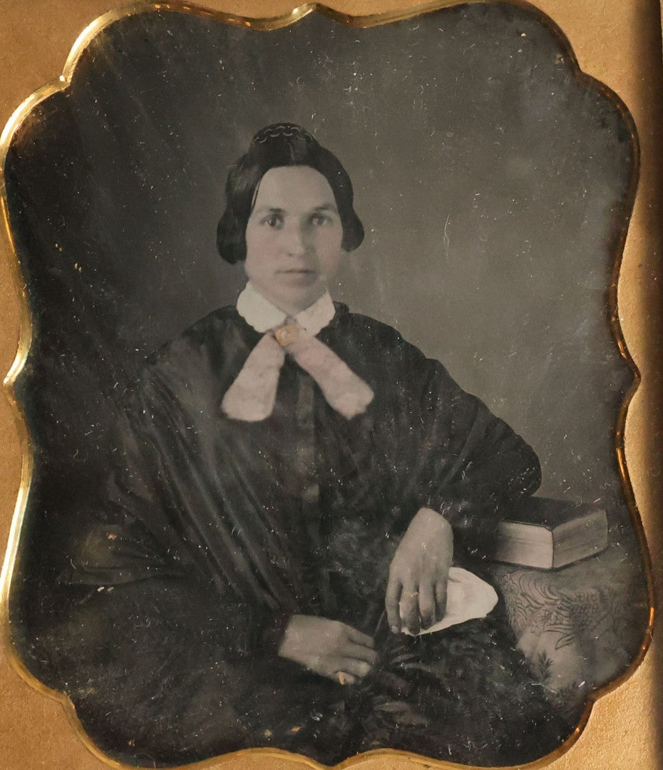 Lot 065 - Antique 1/6th Plate Daguerreotype Photograph Of Woman Wearing Gold Tinted Jewelry Sitting Beside Table With Book, No Case.
