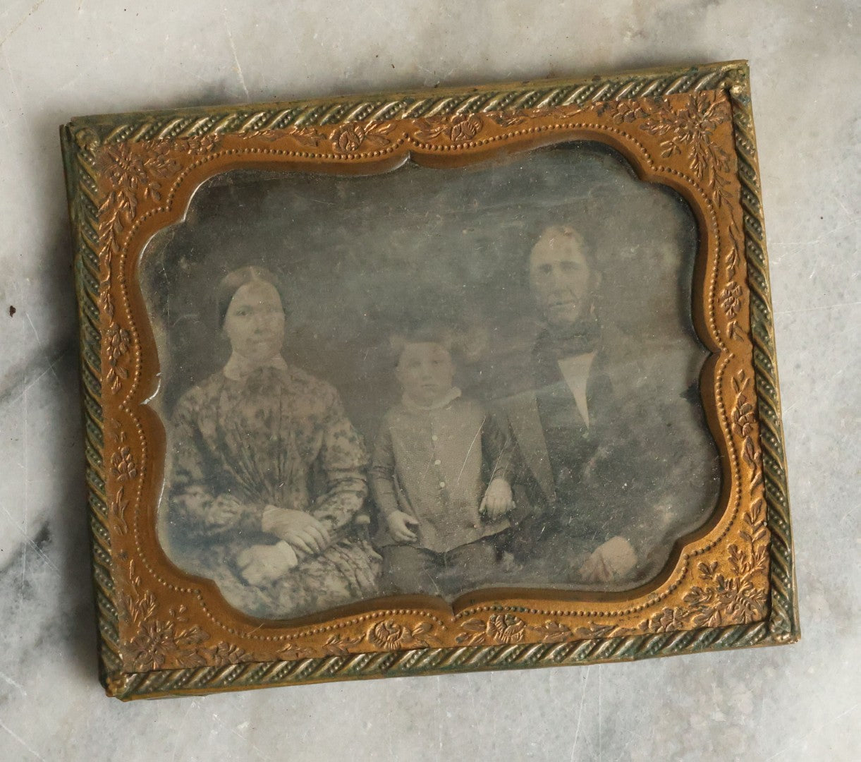 Lot 067 - Antique 1/6th Plate Daguerreotype Photograph Of Mother, Father, And Their Little Boy, Note Cleaning Marks On Photo. No Case.