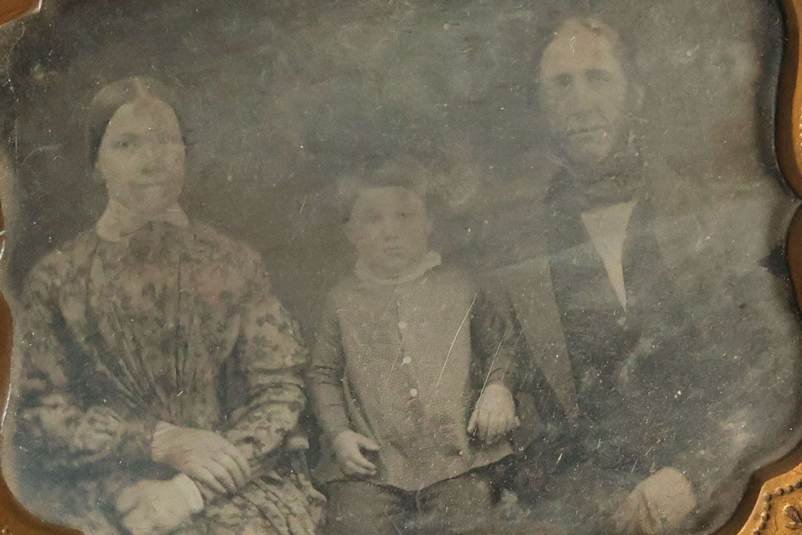Lot 067 - Antique 1/6th Plate Daguerreotype Photograph Of Mother, Father, And Their Little Boy, Note Cleaning Marks On Photo. No Case.