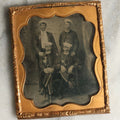 Lot 070 - Antique 1/6th Plate Tintype Photograph With Brass Mat And Preserver Of Four Well Dressed Fraternal Men Wearing Hats And Badges (German Schützen Rifle Competitors)