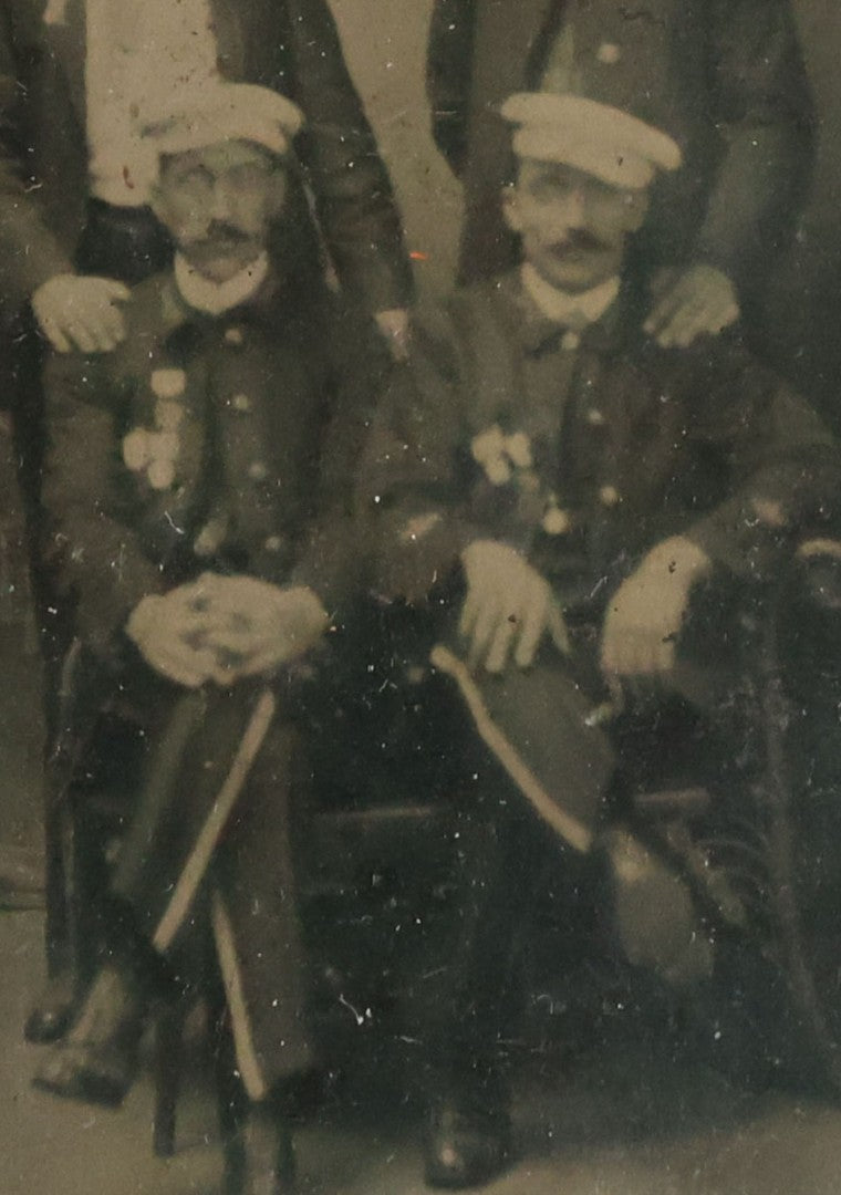 Lot 070 - Antique 1/6th Plate Tintype Photograph With Brass Mat And Preserver Of Four Well Dressed Fraternal Men Wearing Hats And Badges