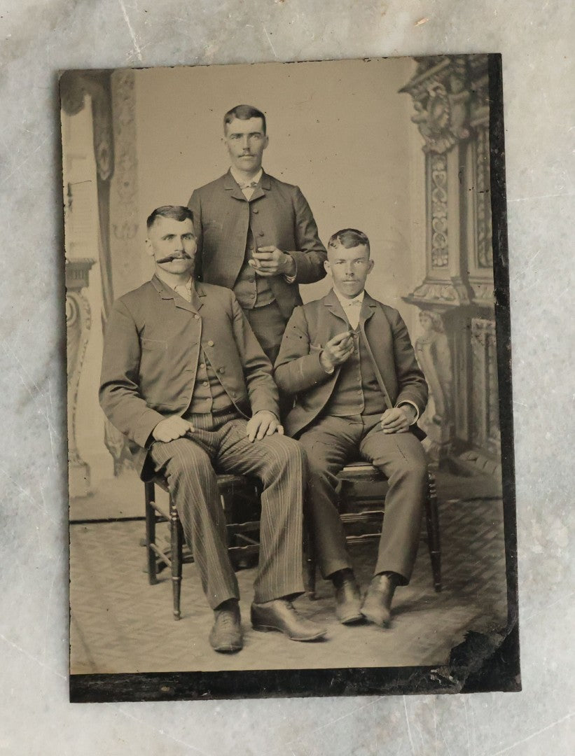 Lot 071 - Single Antique Tintype Photograph Of Three Men In Suits Smoking Cigars, Including Man With Pinstripe Pants