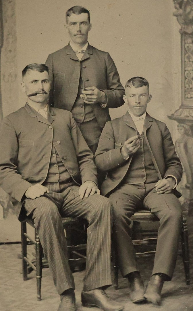 Lot 071 - Single Antique Tintype Photograph Of Three Men In Suits Smoking Cigars, Including Man With Pinstripe Pants