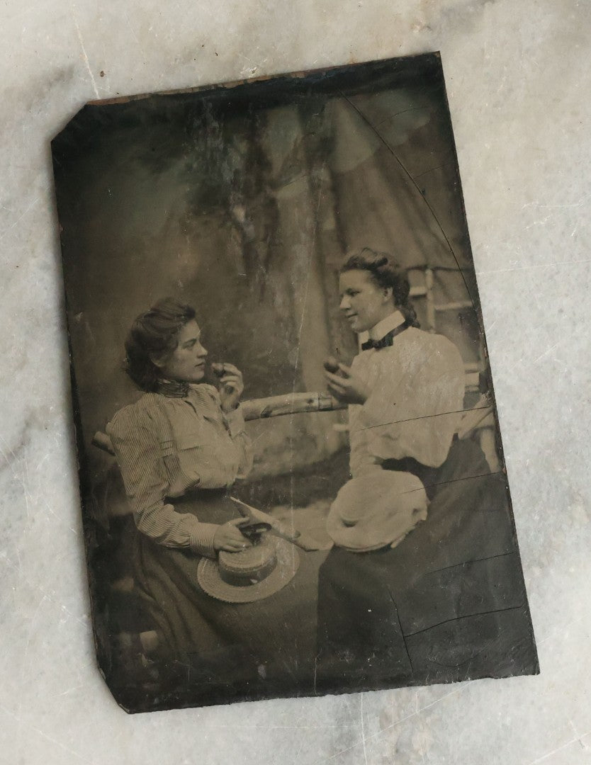 Lot 073 - Single Antique Tintype Photograph Of Two Young Women About To Eat Small Pieces Of Fruit Or Pastry 
