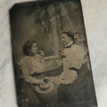 Lot 073 - Single Antique Tintype Photograph Of Two Young Women About To Eat Small Pieces Of Fruit Or Pastry