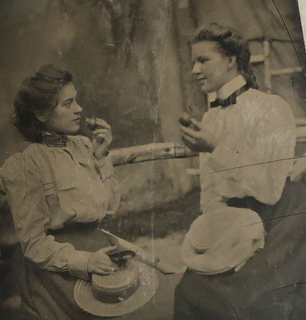 Lot 073 - Single Antique Tintype Photograph Of Two Young Women About To Eat Small Pieces Of Fruit Or Pastry 
