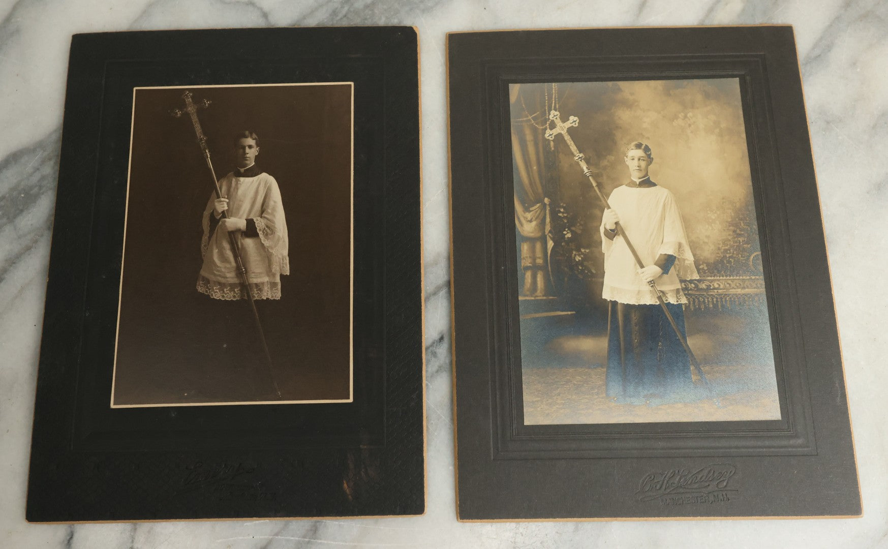 Lot 080 - Pair Of Antique Boarded Photographs Of Young Altar Boys In Their Vestments Holding The Cross On A Staff