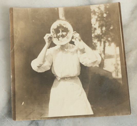 Lot 081 - Antique Snapshot Photograph Of Silly Young Woman Sticking Her Face Through Some Kind Of Cake, Photo Dated June 1908