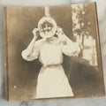 Lot 081 - Antique Snapshot Photograph Of Silly Young Woman Sticking Her Face Through Some Kind Of Cake, Photo Dated June 1908