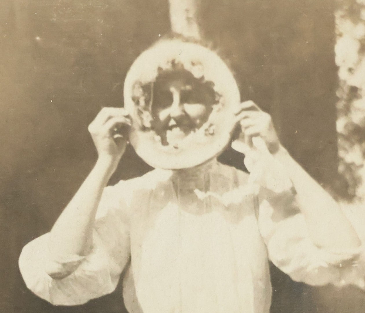 Lot 081 - Antique Snapshot Photograph Of Silly Young Woman Sticking Her Face Through Some Kind Of Cake, Photo Dated June 1908