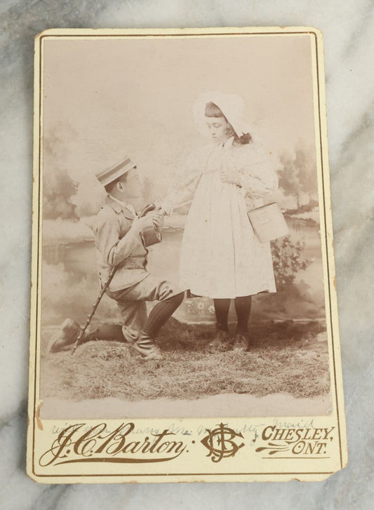 Lot 084 - Antique Cabinet Card Photograph Of Young Boy Courting Young Girl With Handwritten Quote "Will You Marry Me My Pretty Maid", Note On Back "For Lottie Halliday", J.C. Barton, Photographer, Chesley, Ontario