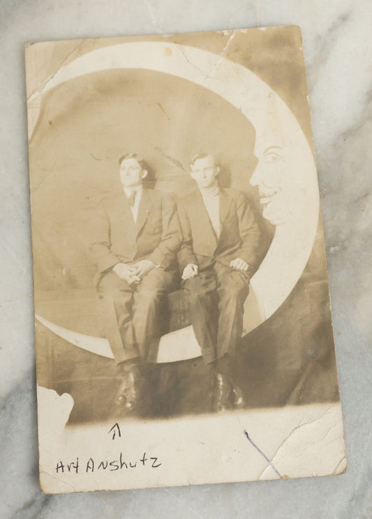 Lot 090 - Antique Real Photo Postcard R.P.P.C. Of Two Men Posing On Paper Moon Backdrop, One Man Identified As Art Anschutz