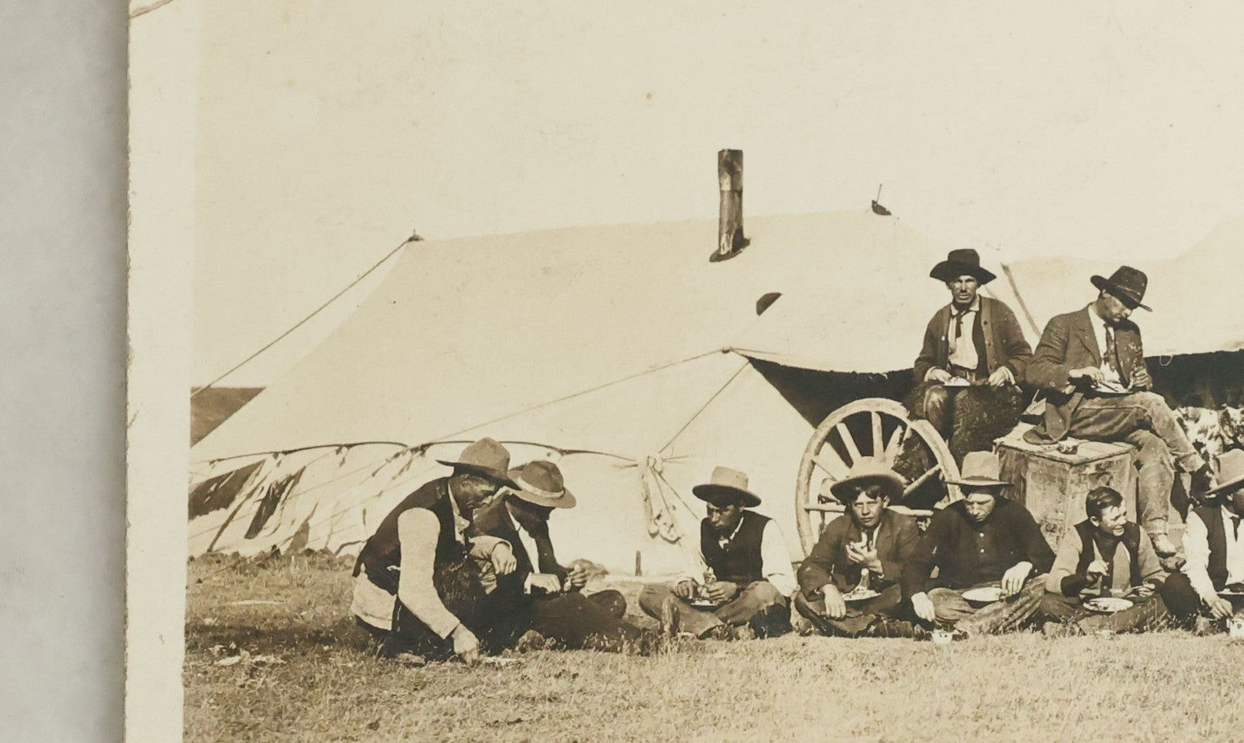 Lot 092 - Antique Real Photo Postcard R.P.P.C. Of Group Of Cowboys, Captioned "Dinner On A Roundup, Western Canada Ranching Series," Copyright 1912, By A.E. Brown