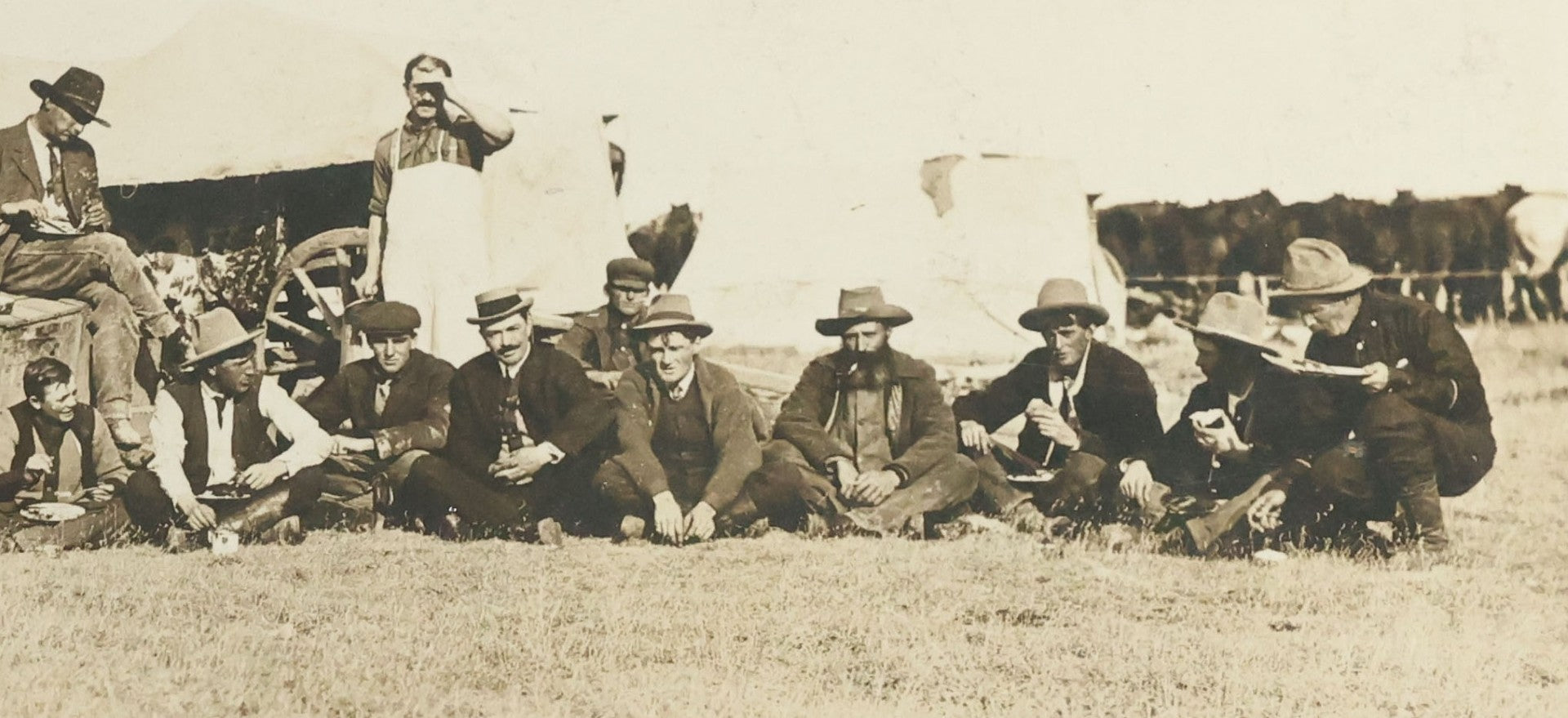 Lot 092 - Antique Real Photo Postcard R.P.P.C. Of Group Of Cowboys, Captioned "Dinner On A Roundup, Western Canada Ranching Series," Copyright 1912, By A.E. Brown
