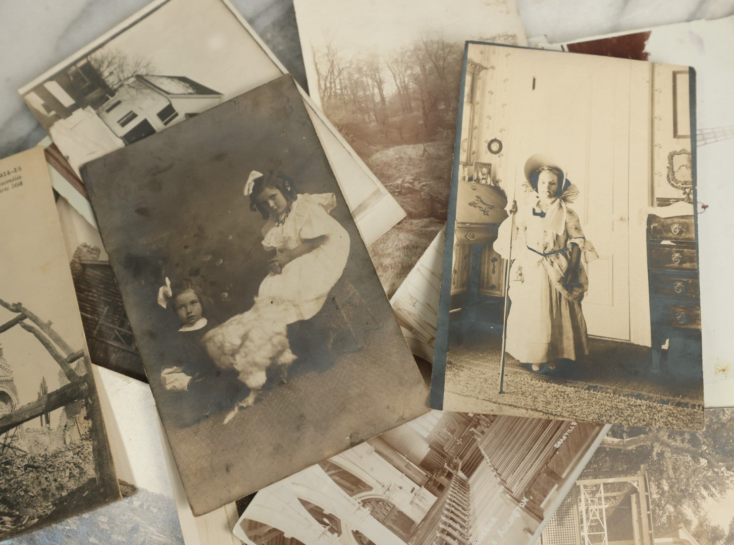 Lot 096 - Grouping Of 24 Antique Real Photo Postcards R.P.P.C. Including Little Girl Dressed As Bo Peep, Little Girls Posing With Chicken, Church Interiors, And Many Exterior Photographs