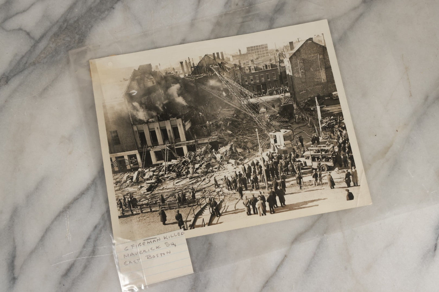 Lot 001 - Extensive Grouping Of 100+ Documentary Press Photos Of Firefighters Battling Fires, Aftermath And Destruction, And Firefighting Apperatus, In And Around The City Of Boston, Late 1930s To 1950s, With Notes Regarding Date And Location, 9" x 7"