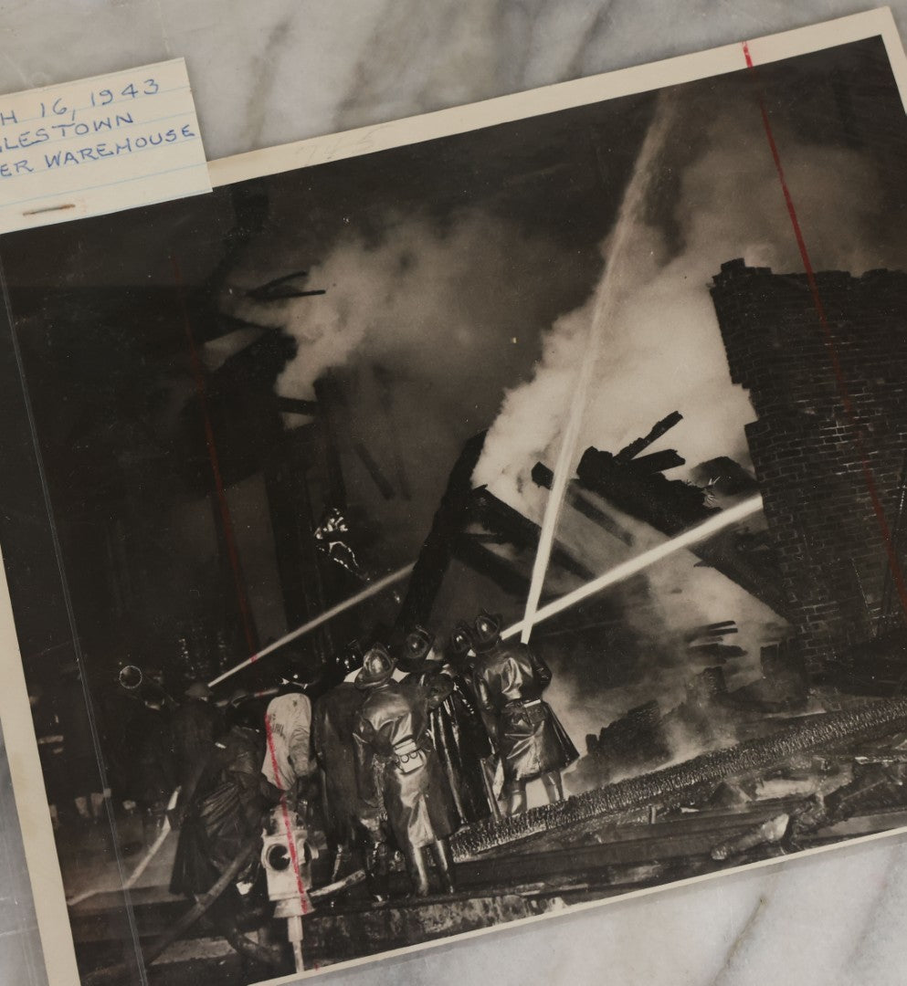 Lot 001 - Extensive Grouping Of 100+ Documentary Press Photos Of Firefighters Battling Fires, Aftermath And Destruction, And Firefighting Apperatus, In And Around The City Of Boston, Late 1930s To 1950s, With Notes Regarding Date And Location, 9" x 7"