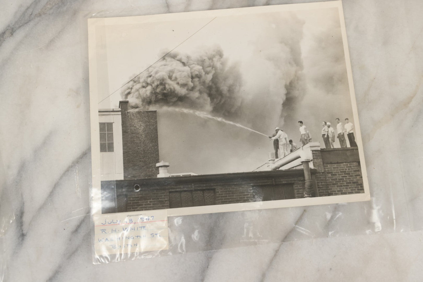 Lot 001 - Extensive Grouping Of 100+ Documentary Press Photos Of Firefighters Battling Fires, Aftermath And Destruction, And Firefighting Apperatus, In And Around The City Of Boston, Late 1930s To 1950s, With Notes Regarding Date And Location, 9" x 7"