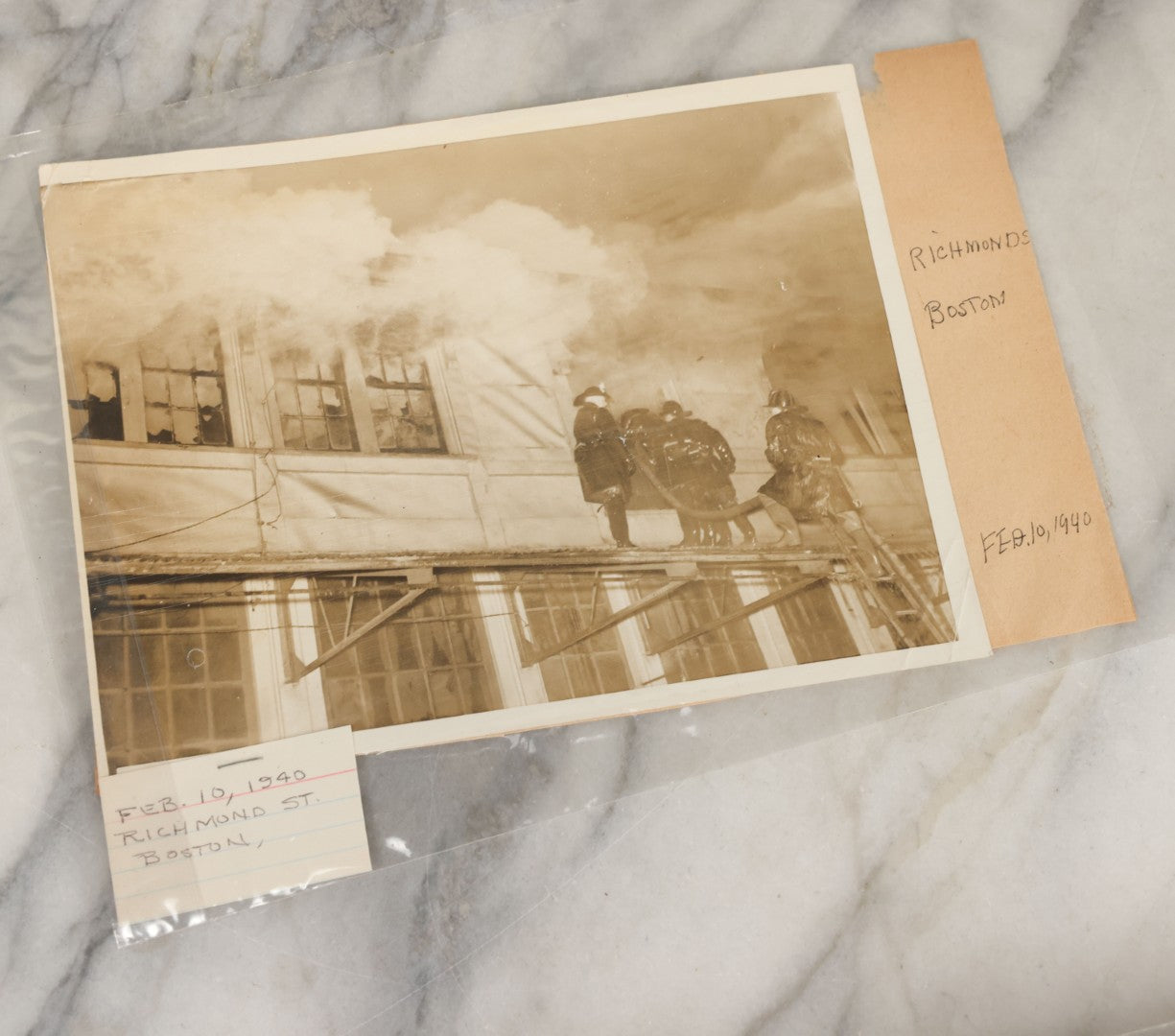 Lot 001 - Extensive Grouping Of 100+ Documentary Press Photos Of Firefighters Battling Fires, Aftermath And Destruction, And Firefighting Apperatus, In And Around The City Of Boston, Late 1930s To 1950s, With Notes Regarding Date And Location, 9" x 7"