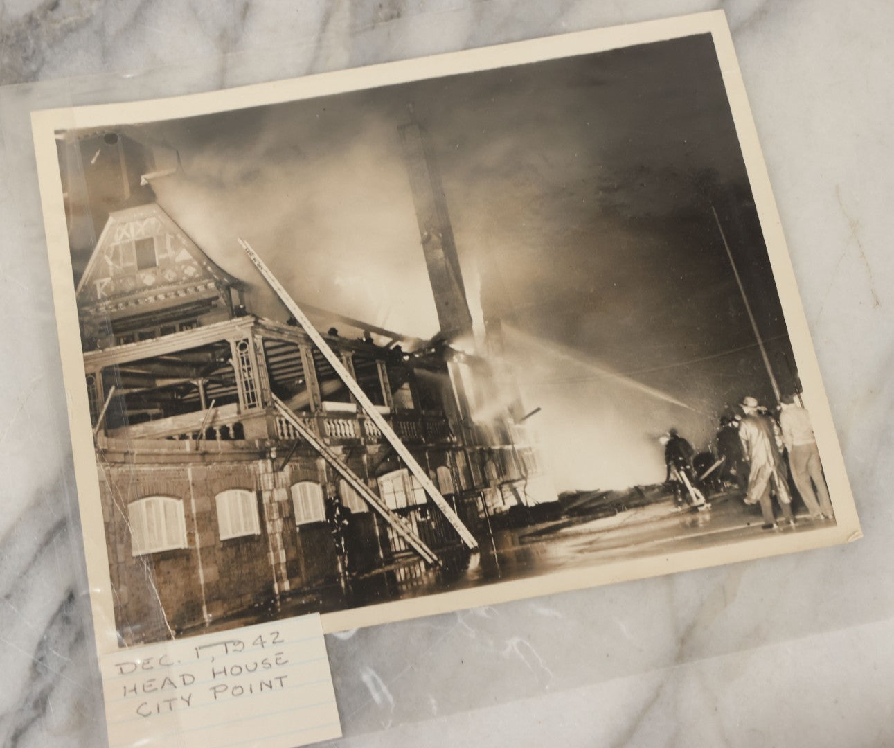 Lot 001 - Extensive Grouping Of 100+ Documentary Press Photos Of Firefighters Battling Fires, Aftermath And Destruction, And Firefighting Apperatus, In And Around The City Of Boston, Late 1930s To 1950s, With Notes Regarding Date And Location, 9" x 7"