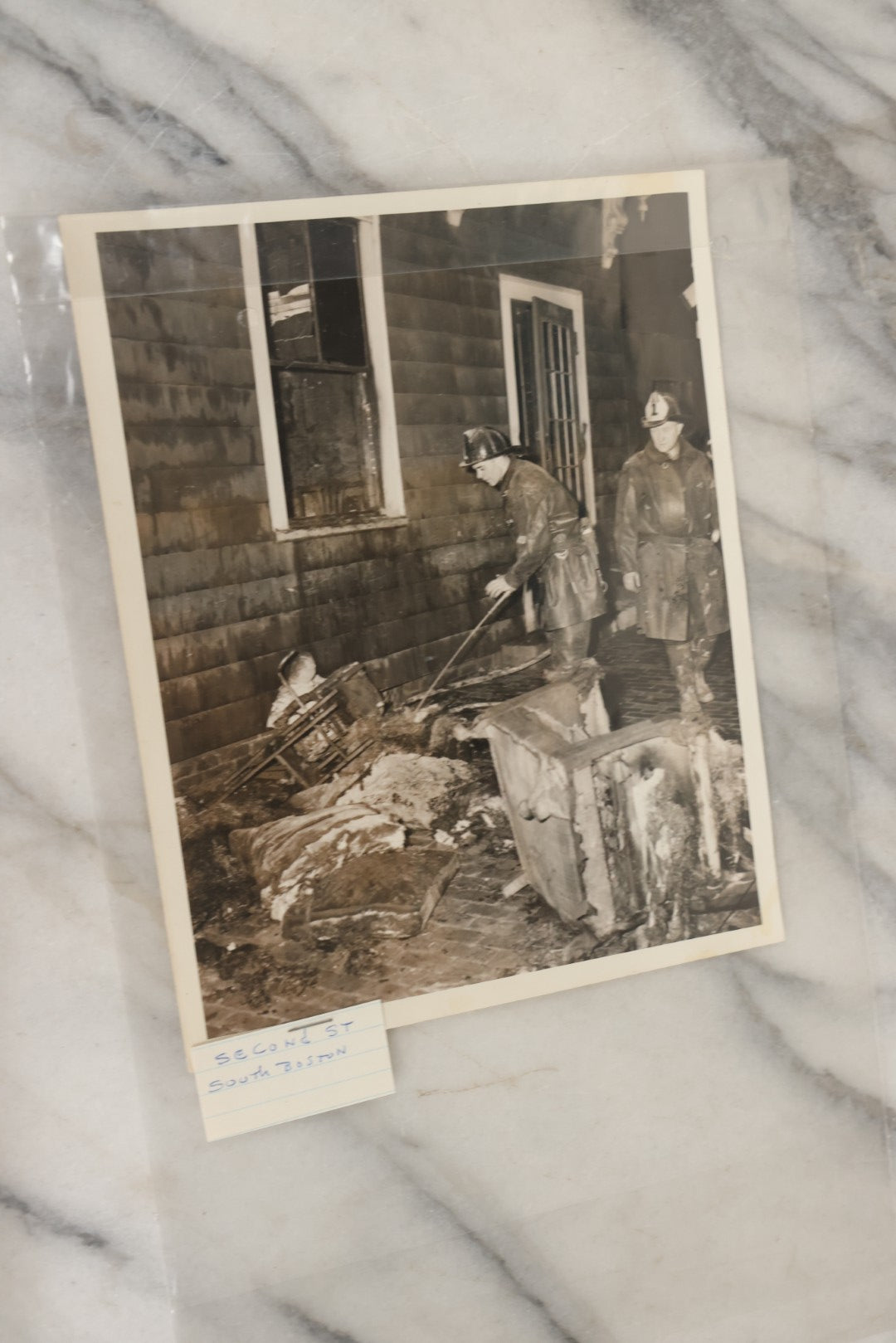 Lot 001 - Extensive Grouping Of 100+ Documentary Press Photos Of Firefighters Battling Fires, Aftermath And Destruction, And Firefighting Apperatus, In And Around The City Of Boston, Late 1930s To 1950s, With Notes Regarding Date And Location, 9" x 7"