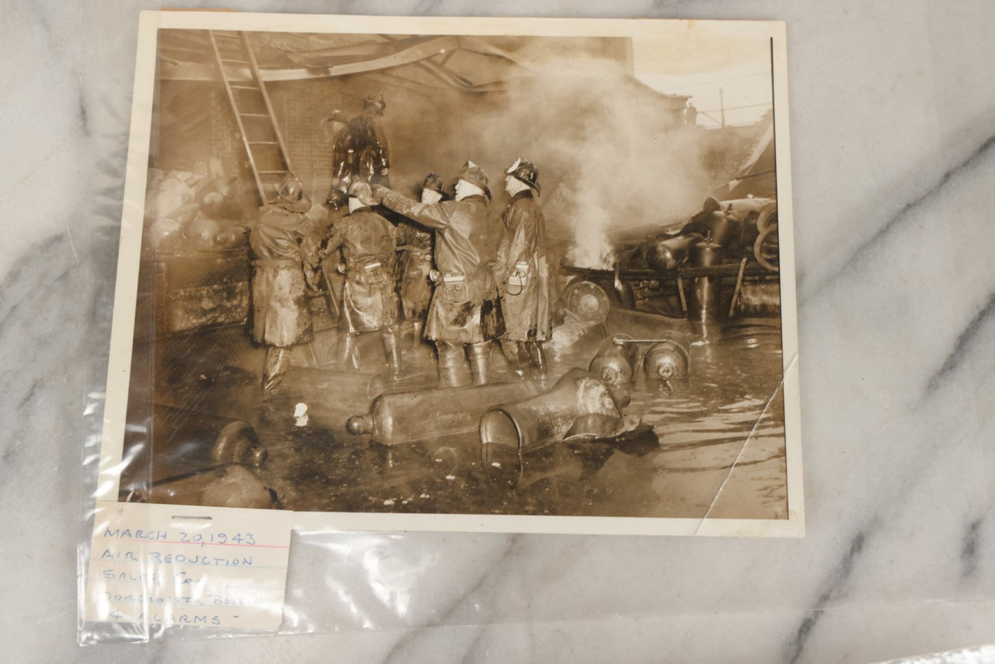 Lot 001 - Extensive Grouping Of 100+ Documentary Press Photos Of Firefighters Battling Fires, Aftermath And Destruction, And Firefighting Apperatus, In And Around The City Of Boston, Late 1930s To 1950s, With Notes Regarding Date And Location, 9" x 7"