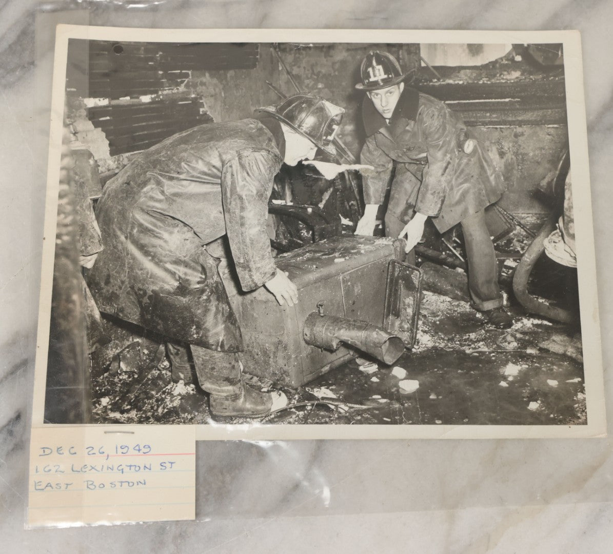 Lot 001 - Extensive Grouping Of 100+ Documentary Press Photos Of Firefighters Battling Fires, Aftermath And Destruction, And Firefighting Apperatus, In And Around The City Of Boston, Late 1930s To 1950s, With Notes Regarding Date And Location, 9" x 7"