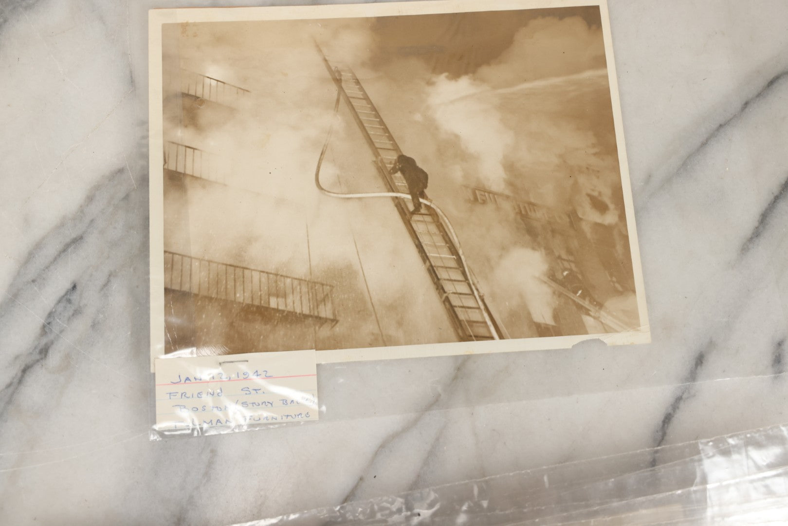 Lot 001 - Extensive Grouping Of 100+ Documentary Press Photos Of Firefighters Battling Fires, Aftermath And Destruction, And Firefighting Apperatus, In And Around The City Of Boston, Late 1930s To 1950s, With Notes Regarding Date And Location, 9" x 7"