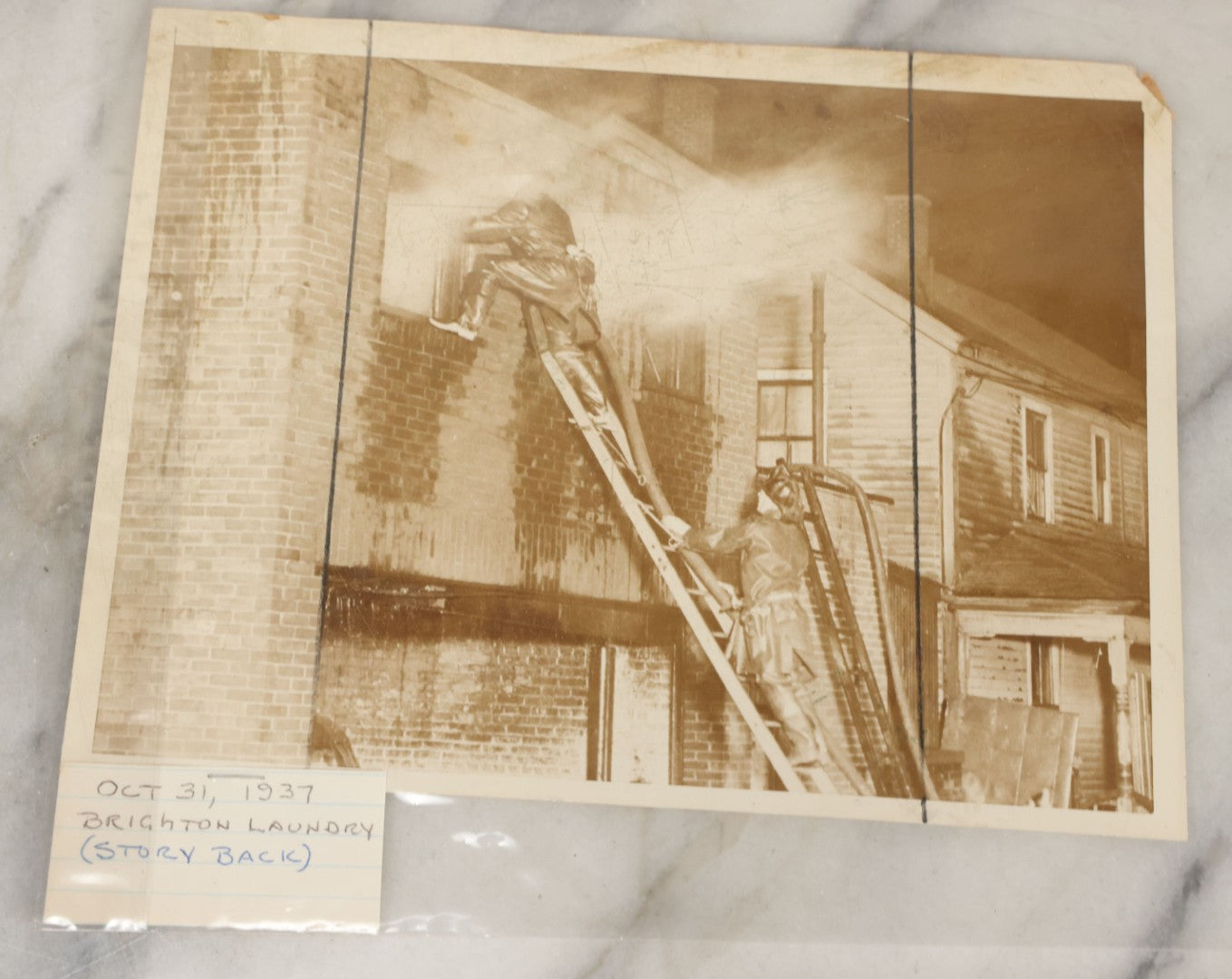 Lot 001 - Extensive Grouping Of 100+ Documentary Press Photos Of Firefighters Battling Fires, Aftermath And Destruction, And Firefighting Apperatus, In And Around The City Of Boston, Late 1930s To 1950s, With Notes Regarding Date And Location, 9" x 7"