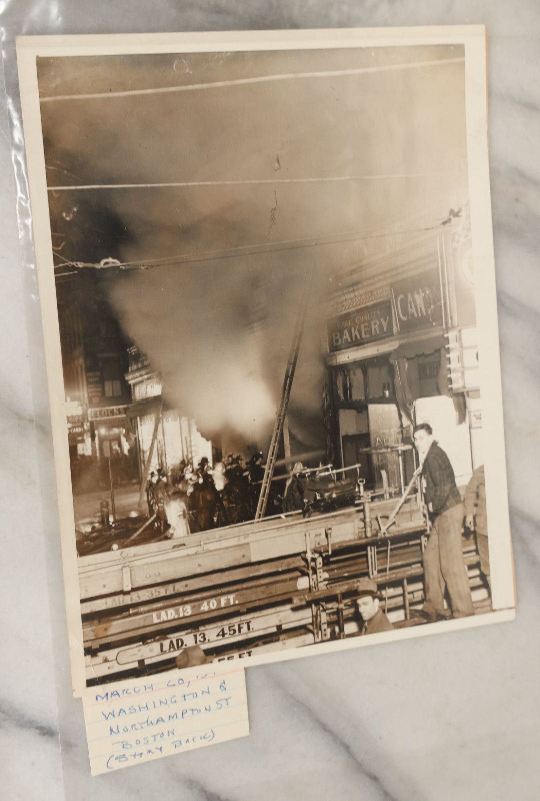 Lot 001 - Extensive Grouping Of 100+ Documentary Press Photos Of Firefighters Battling Fires, Aftermath And Destruction, And Firefighting Apperatus, In And Around The City Of Boston, Late 1930s To 1950s, With Notes Regarding Date And Location, 9" x 7"