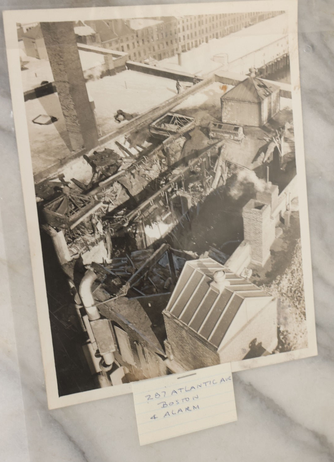Lot 001 - Extensive Grouping Of 100+ Documentary Press Photos Of Firefighters Battling Fires, Aftermath And Destruction, And Firefighting Apperatus, In And Around The City Of Boston, Late 1930s To 1950s, With Notes Regarding Date And Location, 9" x 7"