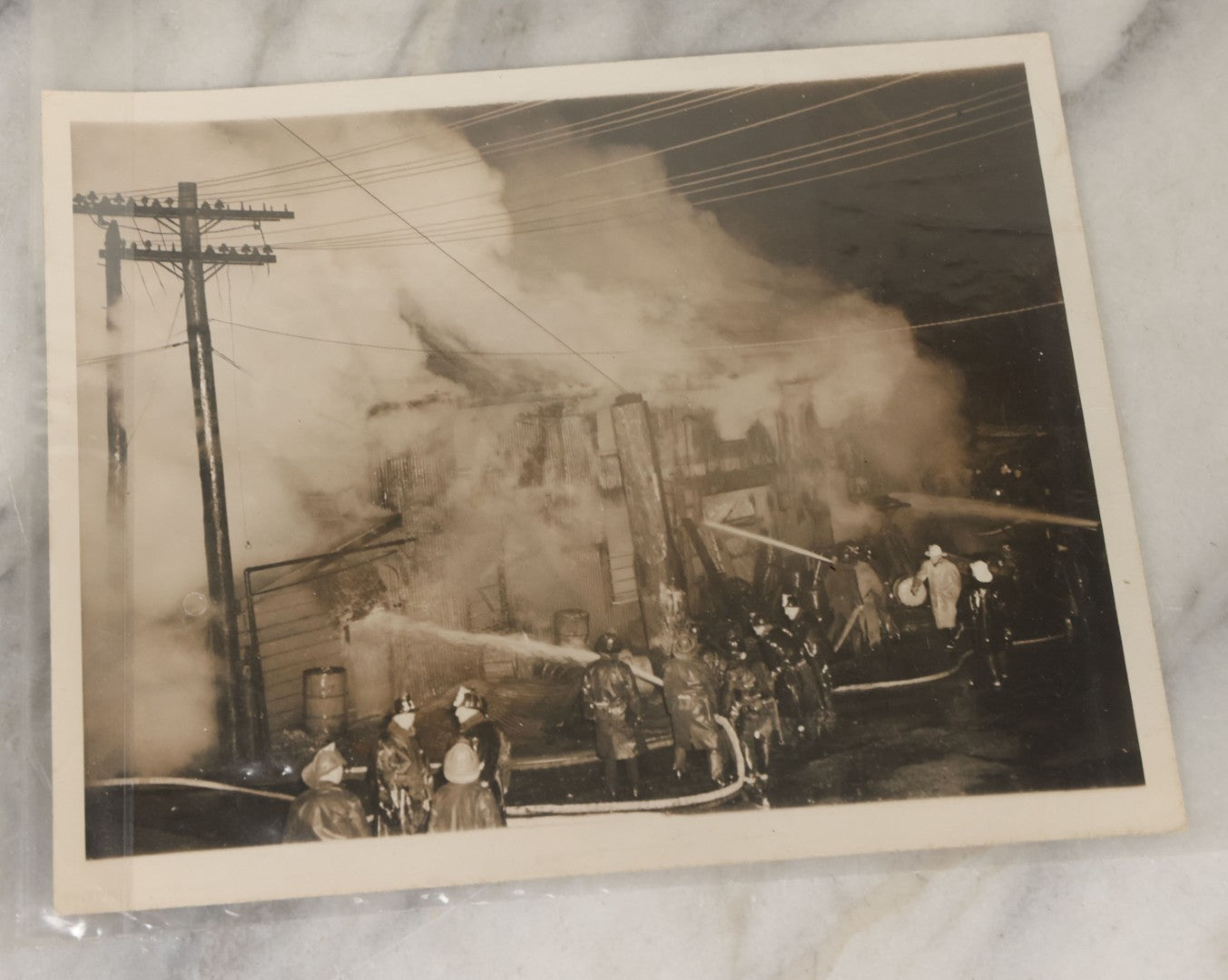 Lot 001 - Extensive Grouping Of 100+ Documentary Press Photos Of Firefighters Battling Fires, Aftermath And Destruction, And Firefighting Apperatus, In And Around The City Of Boston, Late 1930s To 1950s, With Notes Regarding Date And Location, 9" x 7"