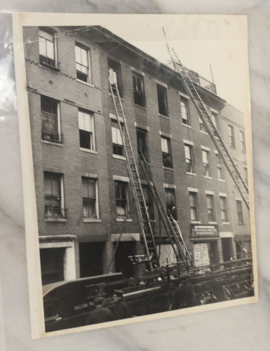 Lot 001 - Extensive Grouping Of 100+ Documentary Press Photos Of Firefighters Battling Fires, Aftermath And Destruction, And Firefighting Apperatus, In And Around The City Of Boston, Late 1930s To 1950s, With Notes Regarding Date And Location, 9" x 7"