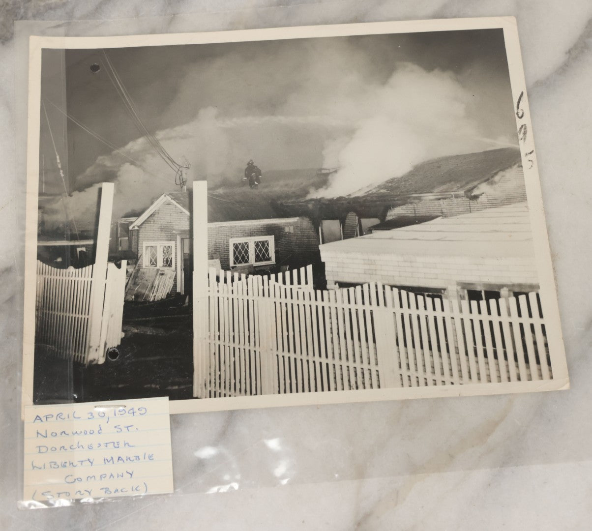 Lot 001 - Extensive Grouping Of 100+ Documentary Press Photos Of Firefighters Battling Fires, Aftermath And Destruction, And Firefighting Apperatus, In And Around The City Of Boston, Late 1930s To 1950s, With Notes Regarding Date And Location, 9" x 7"