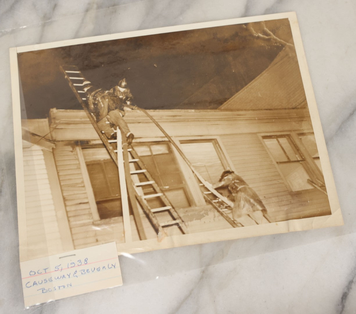 Lot 001 - Extensive Grouping Of 100+ Documentary Press Photos Of Firefighters Battling Fires, Aftermath And Destruction, And Firefighting Apperatus, In And Around The City Of Boston, Late 1930s To 1950s, With Notes Regarding Date And Location, 9" x 7"