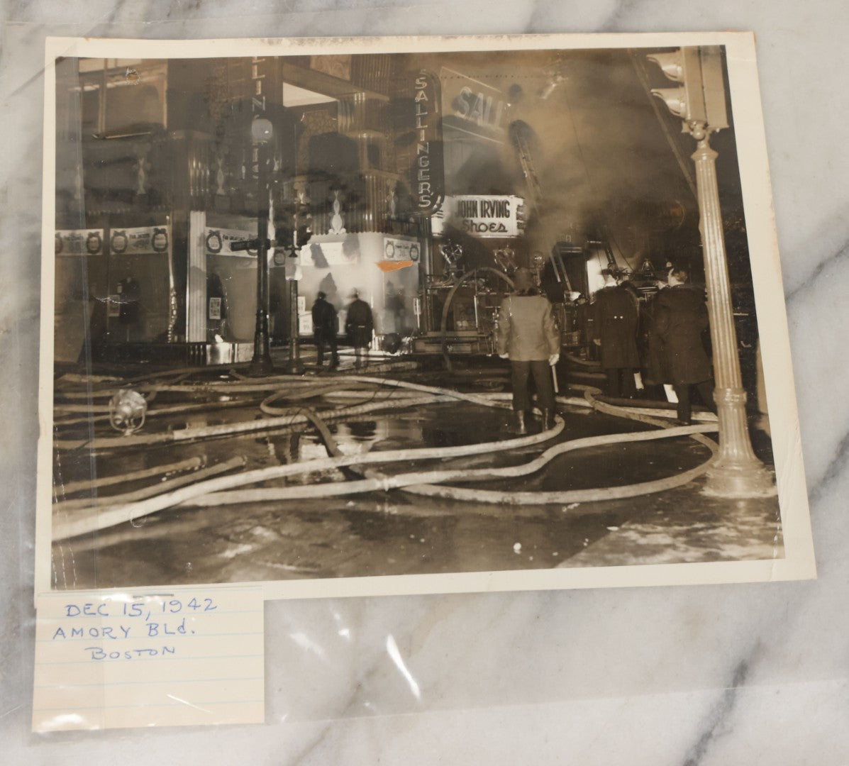 Lot 001 - Extensive Grouping Of 100+ Documentary Press Photos Of Firefighters Battling Fires, Aftermath And Destruction, And Firefighting Apperatus, In And Around The City Of Boston, Late 1930s To 1950s, With Notes Regarding Date And Location, 9" x 7"