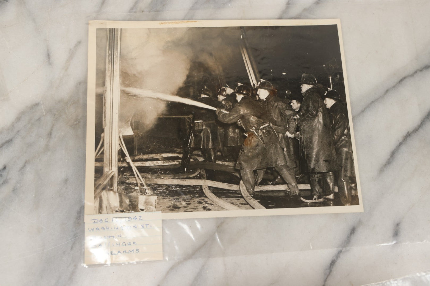 Lot 001 - Extensive Grouping Of 100+ Documentary Press Photos Of Firefighters Battling Fires, Aftermath And Destruction, And Firefighting Apperatus, In And Around The City Of Boston, Late 1930s To 1950s, With Notes Regarding Date And Location, 9" x 7"