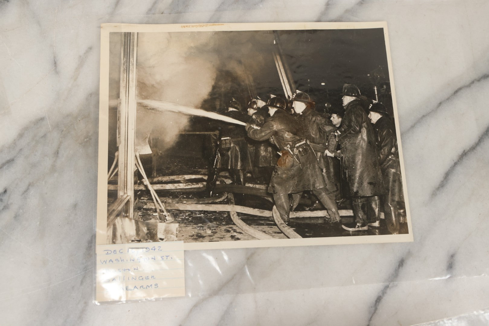 Lot 001 - Extensive Grouping Of 100+ Documentary Press Photos Of Firefighters Battling Fires, Aftermath And Destruction, And Firefighting Apperatus, In And Around The City Of Boston, Late 1930s To 1950s, With Notes Regarding Date And Location, 9" x 7"