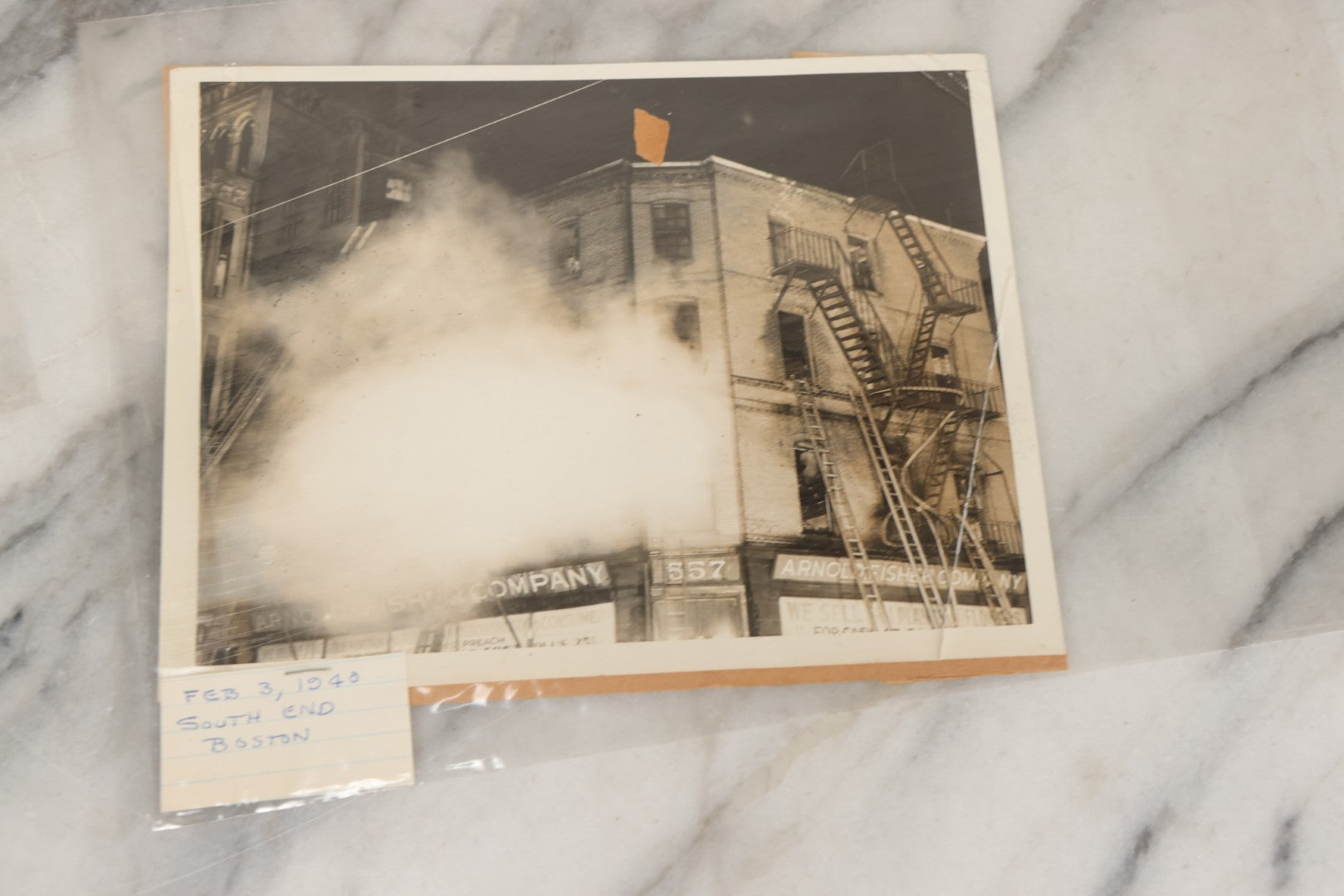 Lot 001 - Extensive Grouping Of 100+ Documentary Press Photos Of Firefighters Battling Fires, Aftermath And Destruction, And Firefighting Apperatus, In And Around The City Of Boston, Late 1930s To 1950s, With Notes Regarding Date And Location, 9" x 7"